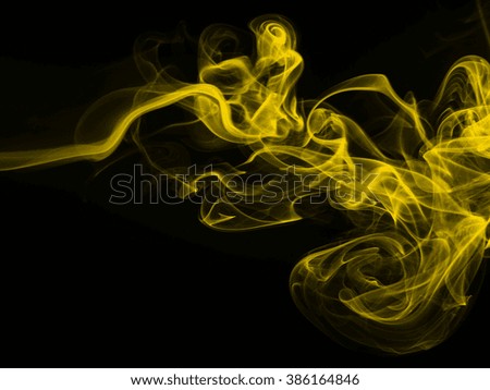 Yellow smoke abstract on black background