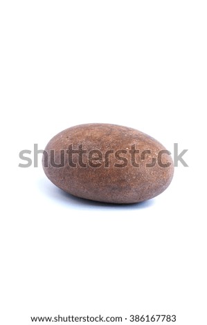 The round stone is isolated on a white background