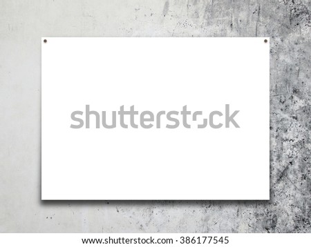 Close-up of one poster paper sheet frame with nails on grey weathered wall background