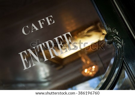 Sign on the window of a French bistro