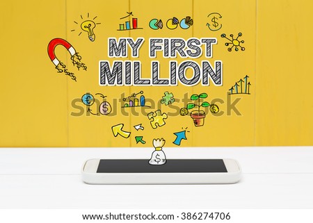 My First Million concept with smartphone on yellow wooden background