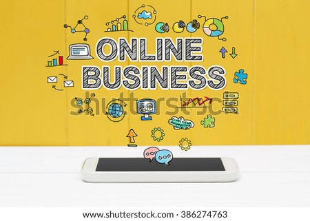 Online Business concept with smartphone on yellow wooden background