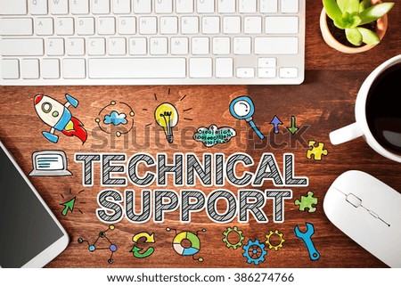 Technical Support concept with workstation on a wooden desk 