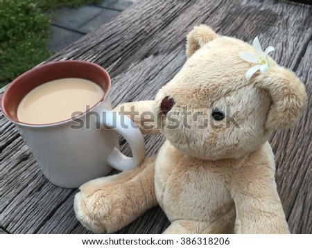 Cute bear doll with morning milk coffee