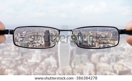 Clear business vision concept businessman looking at the financial district of the city of London