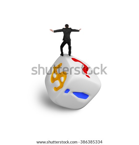 Businessman balancing on dice of dollar sign and punctuation points, isolated on white.