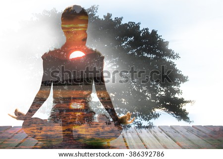 Silhouette of Asian woman yoga on the beach at the sunrise in the morning. Image by double layer technique create for business, healthcare, sport and lifestyle of people.,