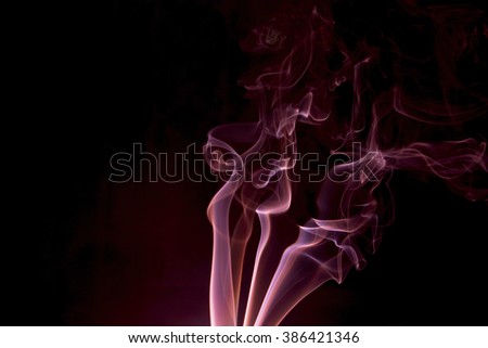 Abstract ed smoke on a black background.