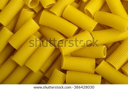 A lot of pasta in a row close-up.