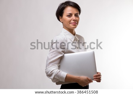 Colour picture of a young attractive business woman in a studio