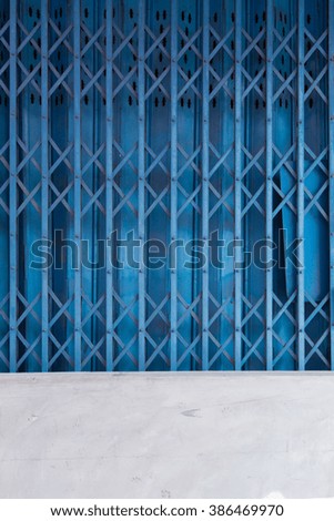 blue steel door with cement.