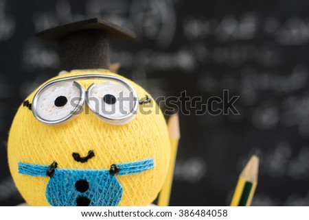 education concept. graduation background.cute graduate toy.
