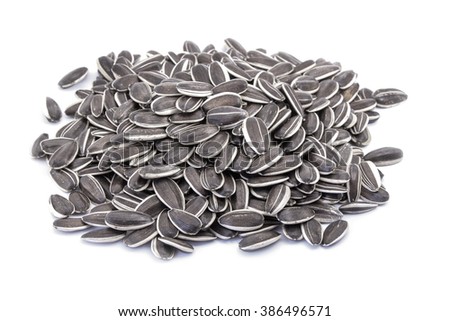 A handful of sunflower seeds closeup isolated on white