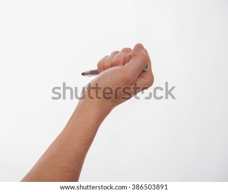 Male hand holding a marker on white background