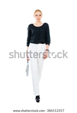 Business woman with folder in her hand. Full length photo.