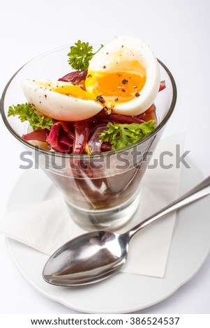 Gourmet jellied meat - pork thigh jelly and pickled eggs in a glass