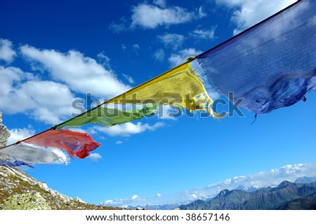 buddhist prayer flags blowing in the wind
