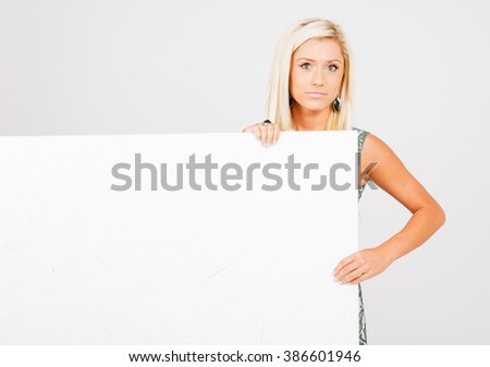 Beautiful girl holding a white board