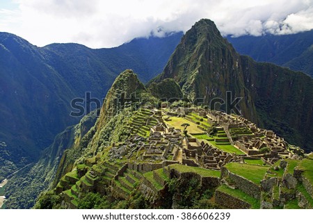Machu Picchu, an Incan Citadel high in the Andes Mountains of Peru Royalty-Free Stock Photo #386606239