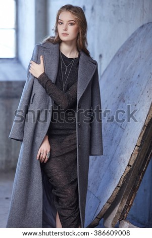 Modern woman in a grey coat.