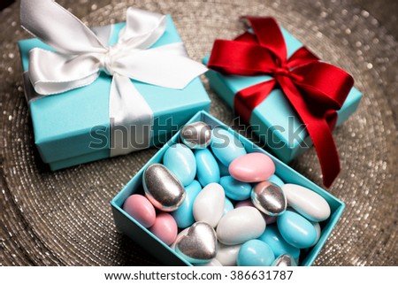 Gift in a beautiful box with a bow, candy