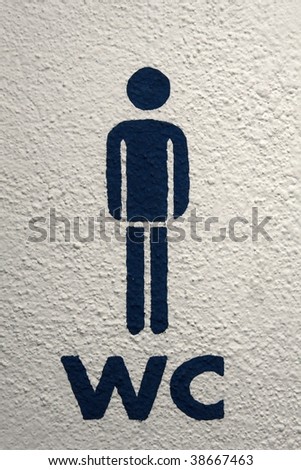 Men's toilet sign on white wall