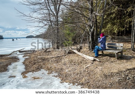 taking photos at a frozen bay on Lake Champlain