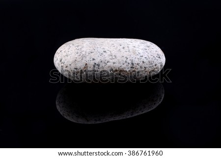 Pebble stone isolated on black background