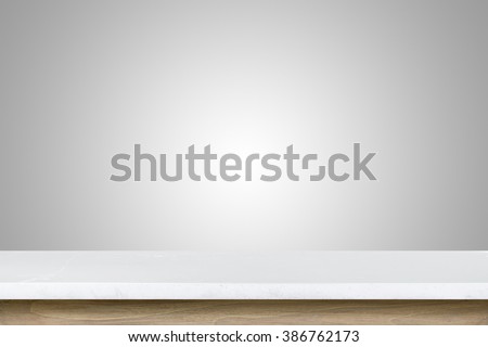 Empty top of granite stone table on grey wall background. For product display