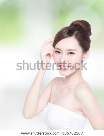 Beautiful Skin care woman Face smile to you with nature green background. asian Beauty