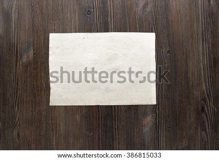white paper on old wooden background