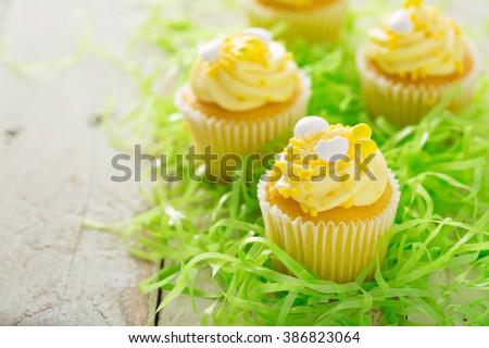 Lemon cupcakes for Easter brunch with yellow frosting and sprinkles