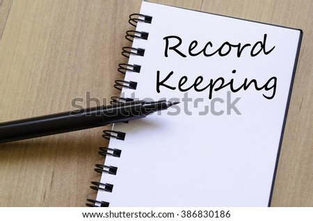 Record keeping text concept write on notebook with pen