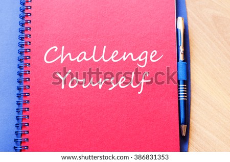 Challenge yourself text concept write on notebook with pen