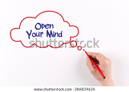 Open Your Mind phrase on white paper, View from above