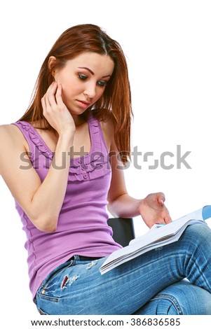 Image of pretty young woman with magazine. Isolated on a white background.