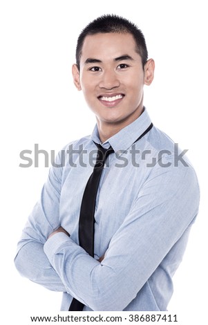 White-collar business young man posing with folded arms