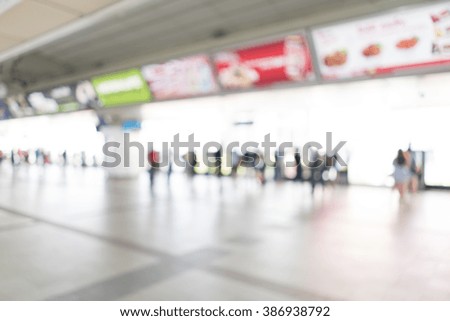 Blurred image of people at train station for background use