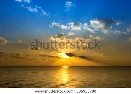 Sunset sky on the lake in south of Thailand., Un-focus image.