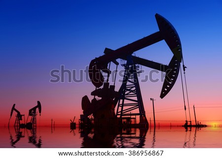 The beam pumping unit is homework, sunset in oil field 