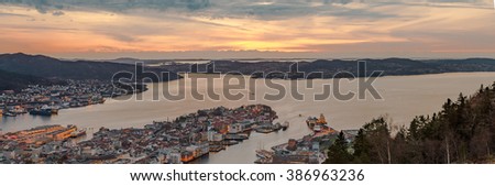 Bergen City, Scenic Aerial View Panorama harbour Cityscape under Dramatic Sky at sunset summer from Top of Mount Floyen Glass Balcony Viewpoint mountain in Norway 