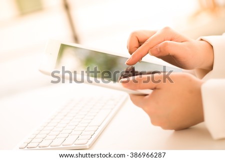 Hands of an office woman typing keyboard with credit card