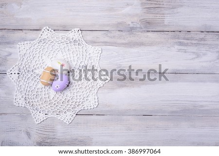 Colorful Easter eggs with white serviette on old cracked wooden background. Copy space. Easter concept. Happy Easter !