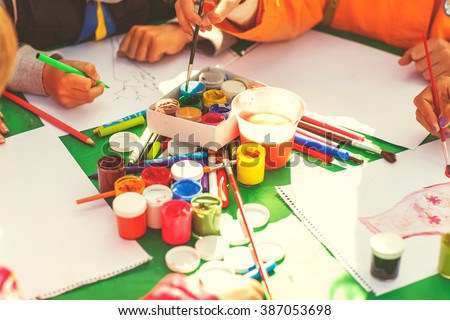 children draw with parents paint beautiful pictures, children's creativity
