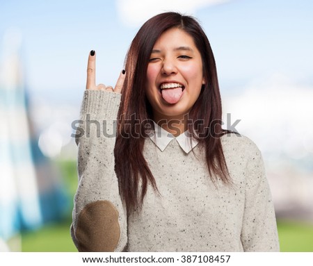 cool chinese-woman rock-gesture