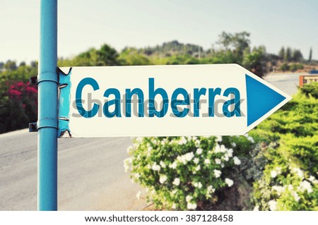 Canberra, Australia Road Sign with beautiful nature and road on background