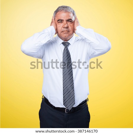 busines man covering his ears