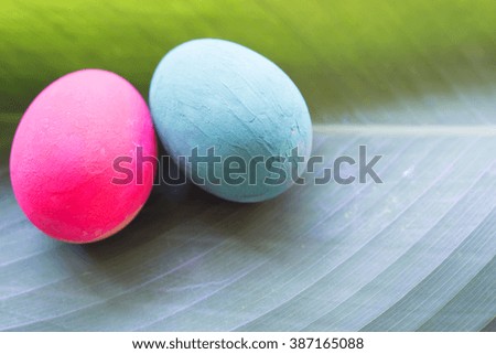 Easter eggs on green leave.