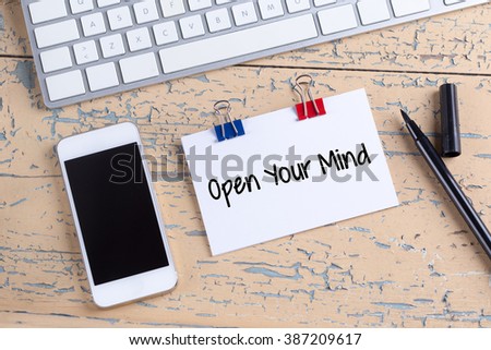Paper note with text Open Your Mind