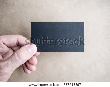 Closeup of hand holding business card Mockup